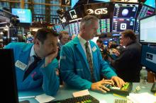 Des traders avant que la cloche de clotûre au New York Stock Exchange, à New York le 14 novembre 2018