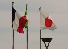 The national flags of France (L) and Japan (R) are displayed at an entrance of Japan's Nissan Motor's Oppama plant in Yokosuka, Kanagawa prefecture, on November 26, 2018.The board of Nissan decided un