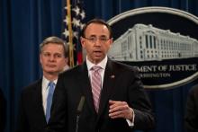 Le numéro deux du ministère de la Justice américain, Rod Rosenstein révèle lors d'une conférence de presse, à Washington le 20 décembre, l'inculpation de deux pirates informatiques chinois, liés à Pék