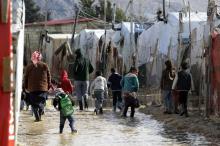 Des réfugiés syriens dans le camp inondé de Delhamiyeh, au Liban, le 17 janvier 2019