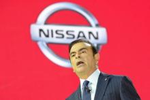 Carlos Ghosn, alors patron de Nissan, lors d'une conférence de presse au siège de Nissan à Tokyo, le 20 novembre 2013