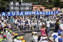 Des volontaires prêtent serment lors d'une cérémonie organisée par l'association "Caolition Aide et Liberté", le 16 février 2019 à Caracas