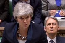 Capture d'une vidéo transmise par le parlement britannique montrant la Première ministre Theresa May s'exprimant devant les députés le 26 février 2019