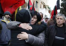 Palestinian lawmaker Khalida Jarrar hugs a supporter shortly after her release from Israeli detention, where she was held for 20 months without trial