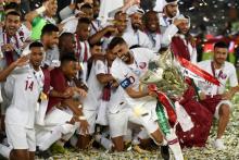 L'équipe du Qatar célèbre sa victoire en finale contre le Japon en Coupe d'Asie, le 1er février 2019 à Abou Dhabi