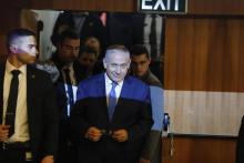Portraits montrant l'ancien chef d'Etat-major israélien Benny Gantz, le 29 janvier 2019 à Tel-Aviv, et le chef du parti centriste Yesh Atid, Yair Lapid, le 18 février 2019 près de Tel-Aviv