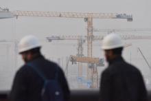 Des ouvriers sur le chantier du nouvel aéroport de Pékin-Daxing, le 1er mars 2019
