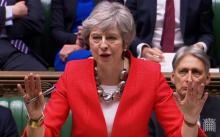 Capture d'écran d'une vidéo fournie par le Parliamentary Recording Unit (PRU) du Parlement britannique montrant la première ministre Theresa May lors du débat sur l'accord de retrait du Royaume-Uni, s