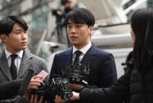 La star de K-pop Jung Joon-young se présente à un interrogatoire de la police à Séoul, le 14 mars 2019