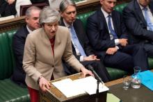 Photo fournie par le Parlement britannique montrant la Première ministre britannique Theresa May devant les députés, le 29 mars 2019