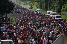 Des migrants venant du Honduras avancent en caravane vers les Etats-Unis, le 21 octobre 2018 à Ciudad Hidalgo, au Mexique
