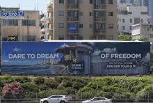 Photo prise le 13 mai 2019 d'une affiche de l'ONG israélienne Breaking the Silence parodiant le slogan de l'Eurovision, sur une autoroute à Tel-Aviv