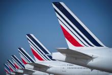 Des avions d'Air France stationnés sur le tarmac de l'aéroport parisien Roissy-Charles de Gaulle le 7 août 2018