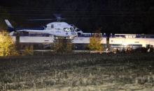 Un hélicoptère des services de secours quitte les lieux d'une collision à un passage à niveau, le 12 octobre 2011 à Saint-Médard-sur-Ille, près de Rennes