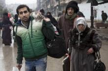 Des civils fuyants le massacre d'Alep, en Syrie.