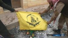 Milice afghane drapeau brulé daech etat islamique défaite palmyre armée syrienne