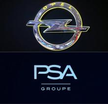 Le logo d'Opel et et celui de PSA. Le groupe français souhaite racheter le constructeur allemand