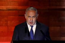 Le Premier ministre israélien Benjamin Netanyahu s'exprime durant une cérémonie marquant l'Holocauste au mémorial de Yad Vashem à Jérusalem, le 11 avril 2018