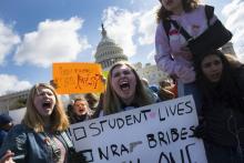 Des lycéens participent le 14 mars 2018 à Washington à un rassemblement en hommage aux victimes de la fusillade de Parkland