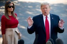 Melania et Donald Trump dans les jardins de la Maison Blanche avant d'embarquer pour leur tournée en Europe le 10 juillet 2018