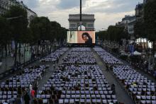 Les Champs-Élysées transformés, le temps d'une soirée en cinéma géant, avec la projection du film "Les Visiteurs", le 1er juillet 2018 à Paris