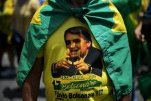 Des partisans du candidat d'extrême droite à la présidentielle Jair Bolsonaro lors d'un rassemblement, le 21 octobre 2018 à Rio de Janeiro, au Brésil