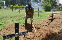 Piyasri Gunasena digs a grave at Madampitiya cemetery in Sri Lanka's capital Colombo -- he usually only digs one a day but since the Easter Sunday attacks, he is far busier