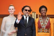 L'actrice américaine Elle Fanning, le réalisateur mexicain et président du jury du Festival de Cannes Alejandro Gonzalez  Iñarritu et la réalisatrice burkinabé Maimouna N'Diaye au festival de Cannes l