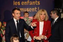 Emmanuel et Brigitte Macron, à Paris à la manufacture des Gobelins le 19 décembre 2018 pour célébrer le Noël des enfants du personnel de l'Elysée