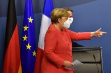 Angela Merkel et Emmanuel Macron lors d'une conférence de presse à la fin du sommet européen, à Bruxelles le 21 juillet 2020