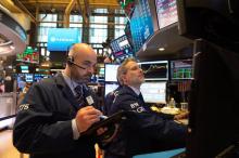 Traders sur le parquet du New York Stock Exchange le 17 mai 2018 à New York