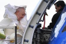 Pope Francis boards his plane from a lift designed for the boarding and off boarding of reduced mobility passengers, on April 02, 2022 at Rome's Fiumicino airport, as he departs for a two-day trip to 